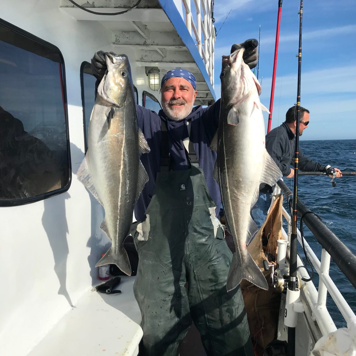 a man holding a fish