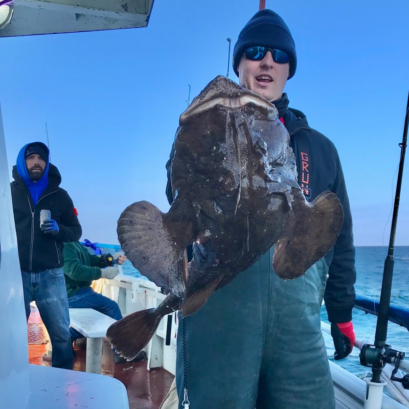 a couple of people that are standing in the snow