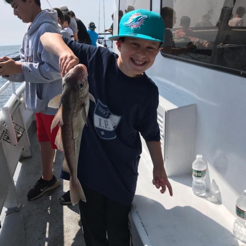 a person holding a fish