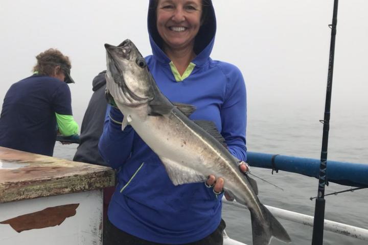 a person holding a fish