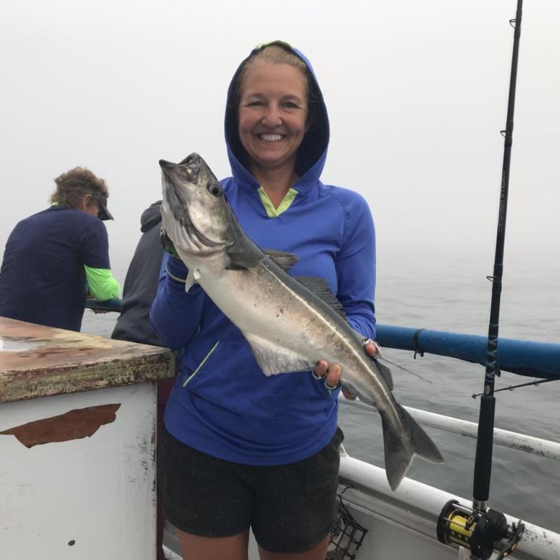 a person holding a fish