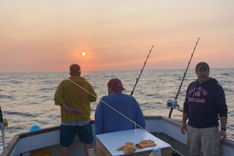 a group of people on a boat in the water