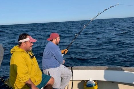 a group of people on a boat in the water