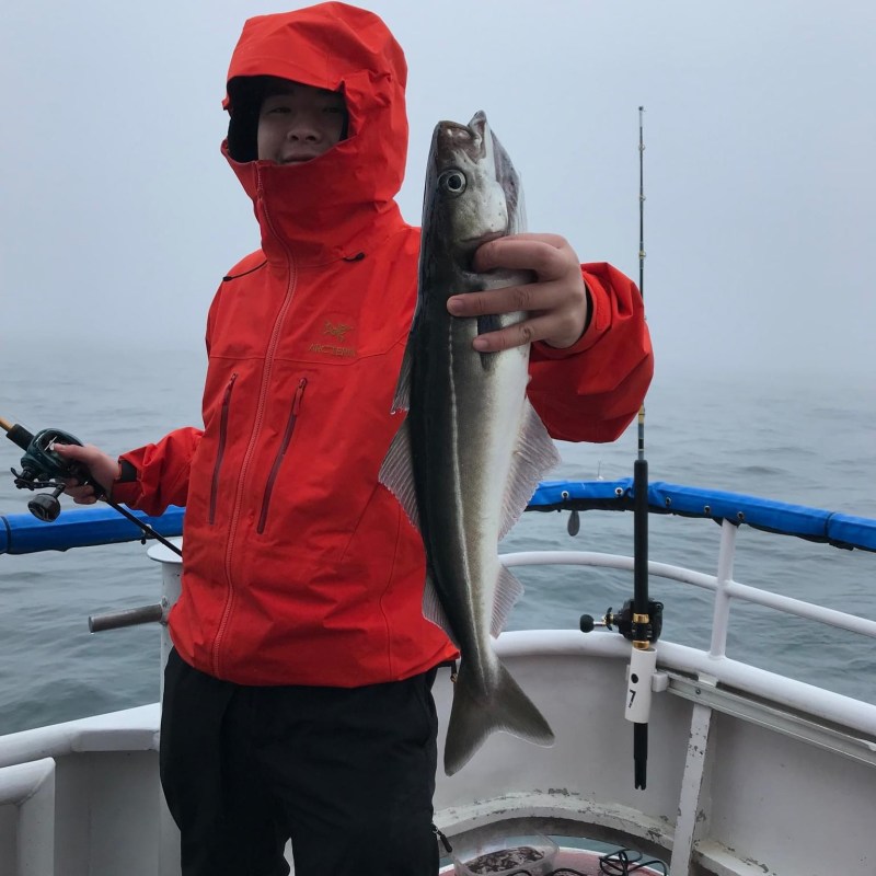 a person holding a fish in the water