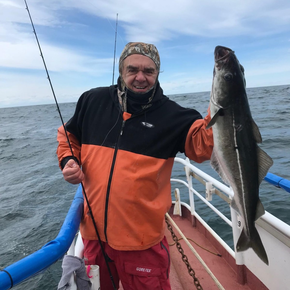 a person holding a fish in the water