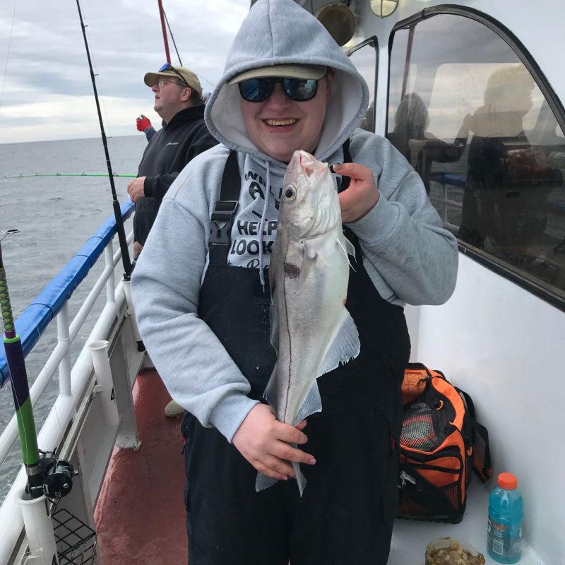 a person holding a fish