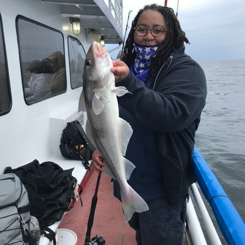 a person holding a fish