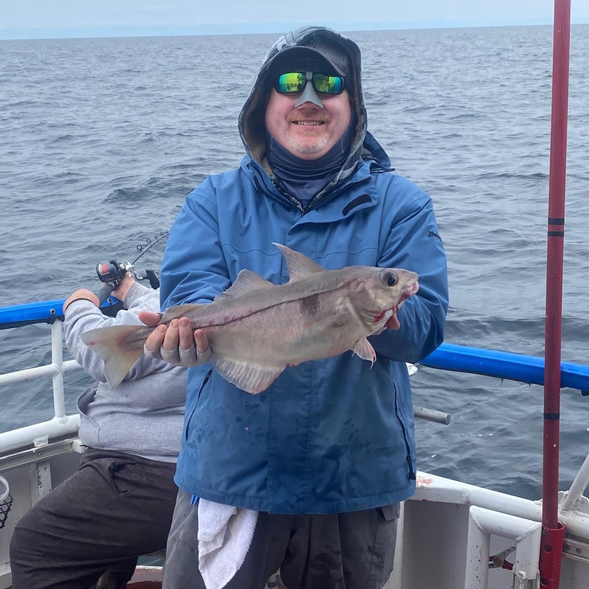 a person holding a fish in the water