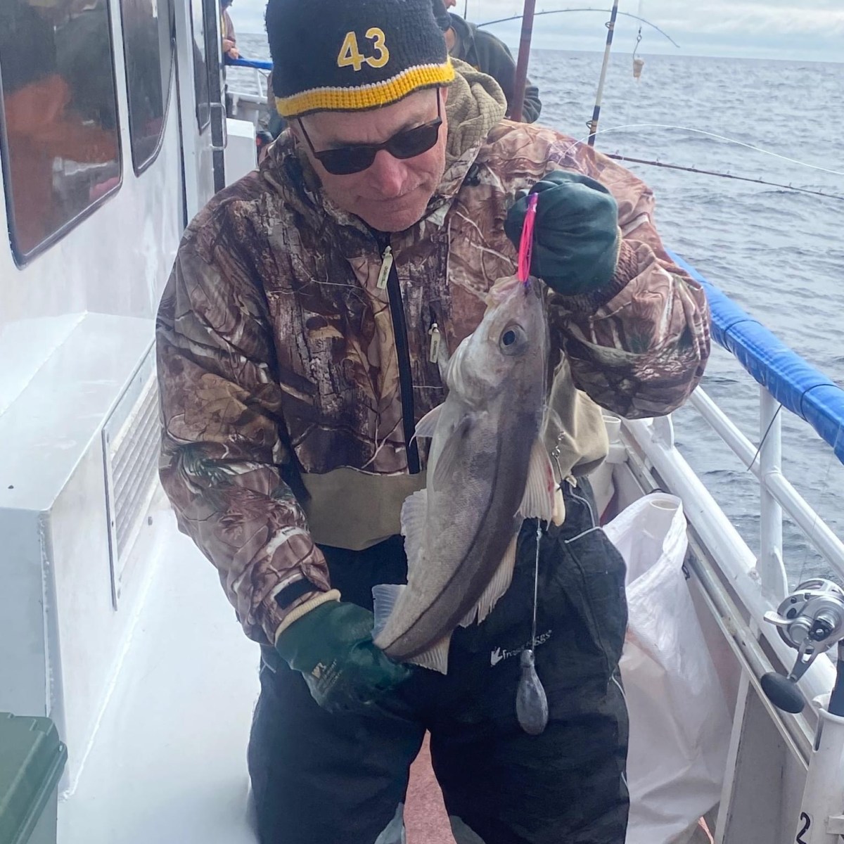 a person holding a fish