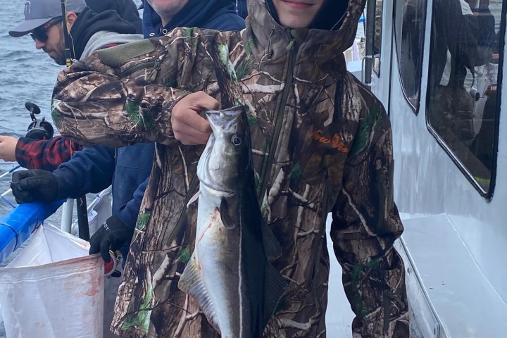 a man holding a fish