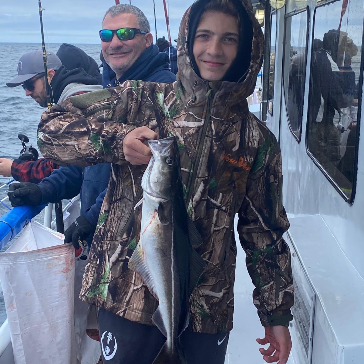 a man holding a fish