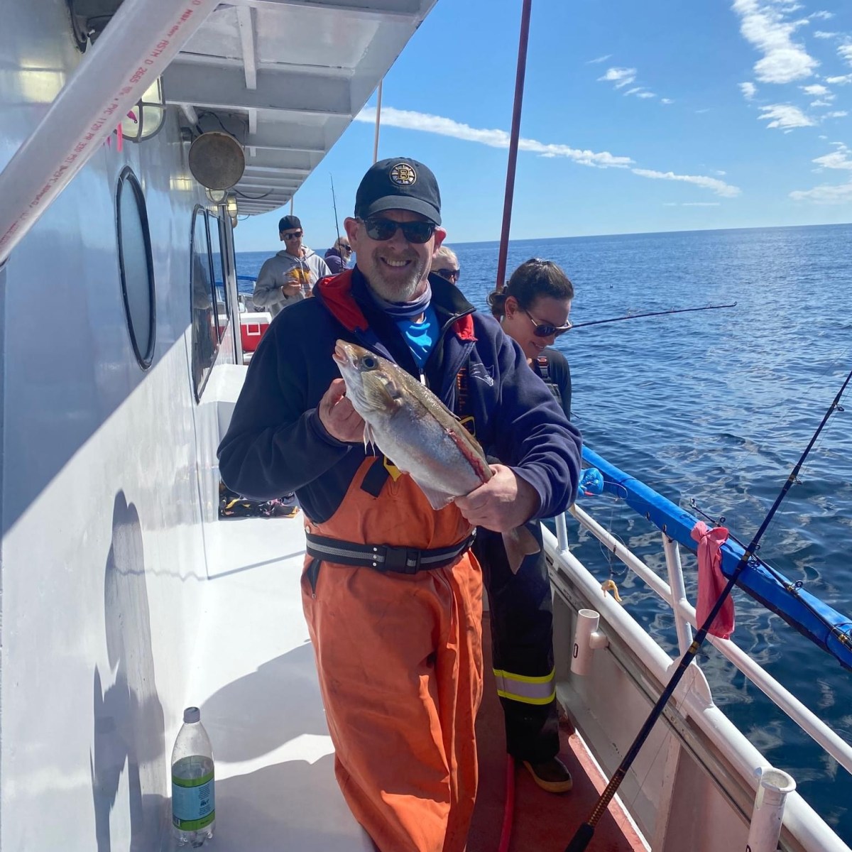 a man standing on a boat in the water
