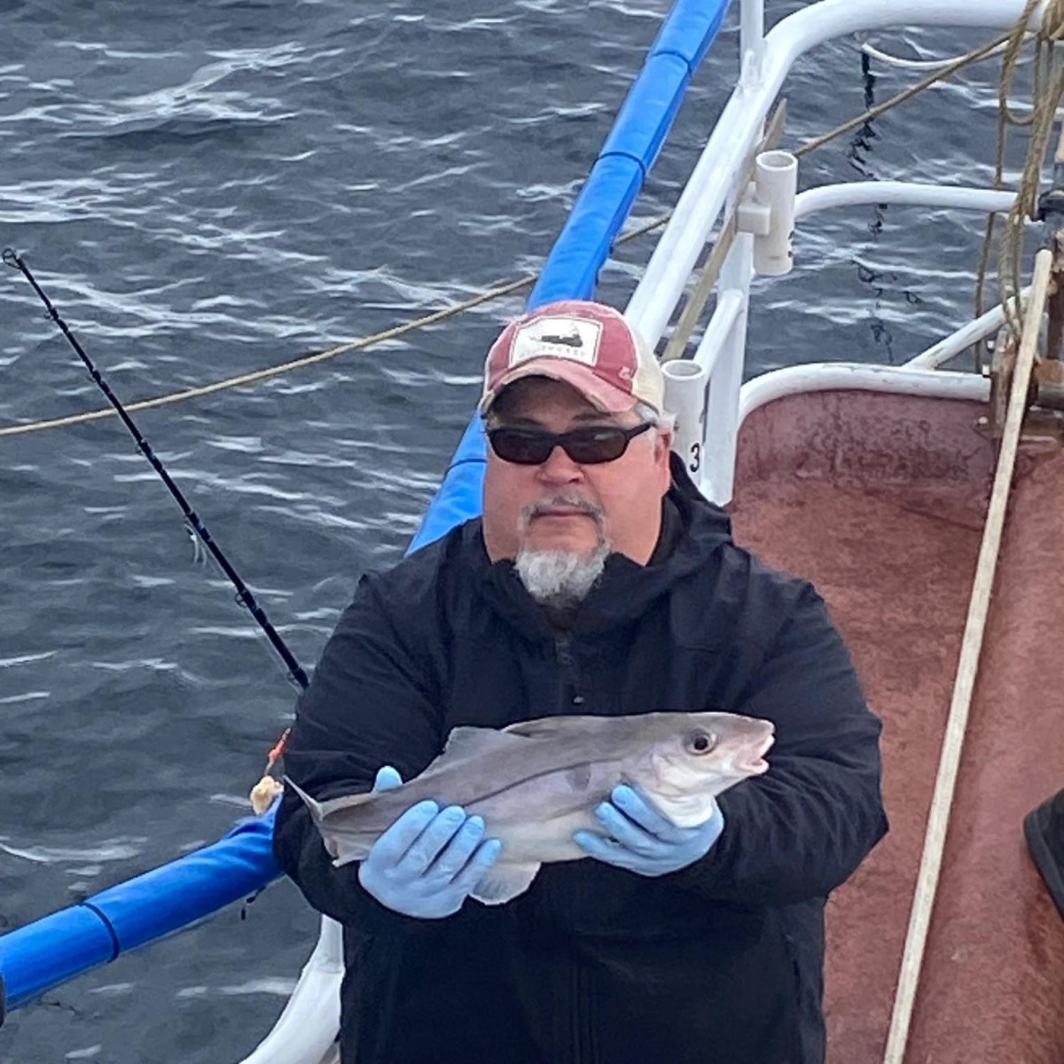 a person standing next to a body of water