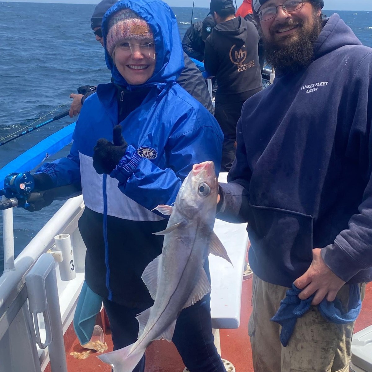 a person standing next to a body of water