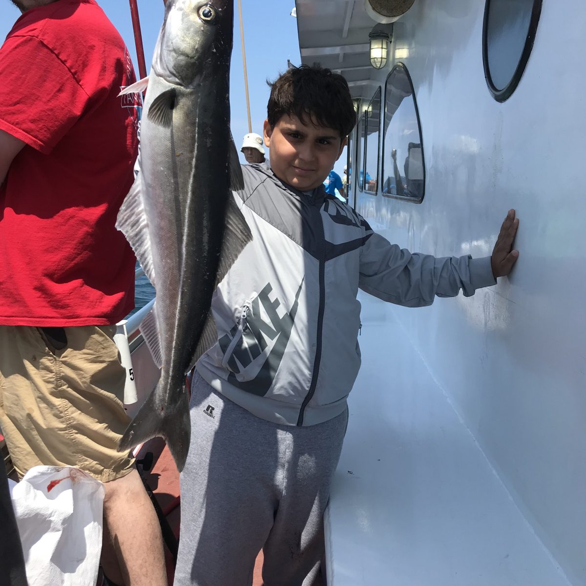 a person holding a fish