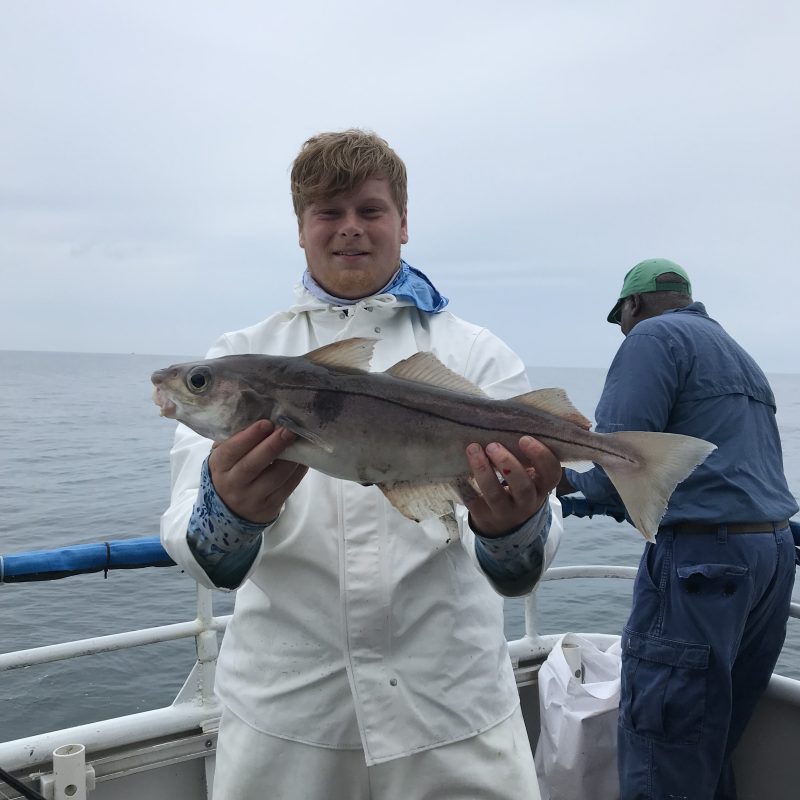 a man holding a fish
