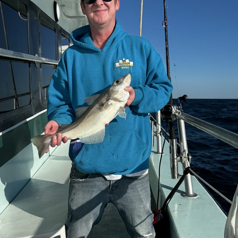 a man holding a fish