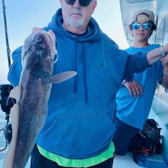 a man holding a fish