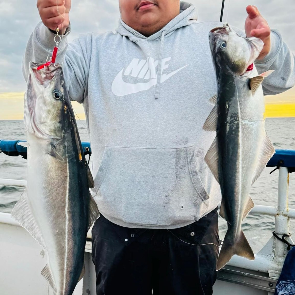 a man holding a fish