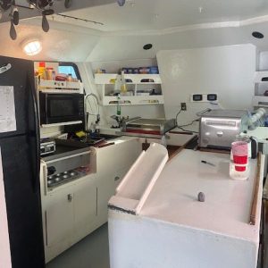 a kitchen with a sink and a refrigerator