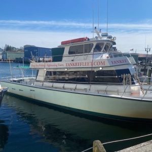 a boat is docked next to a body of water