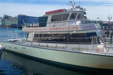 a boat is docked next to a body of water