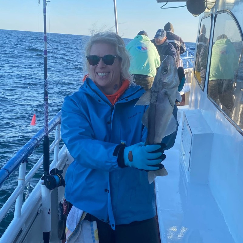 a couple of people that are standing in the snow