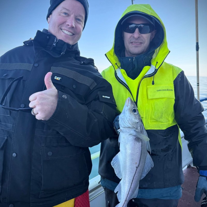 a couple of people that are standing in the snow