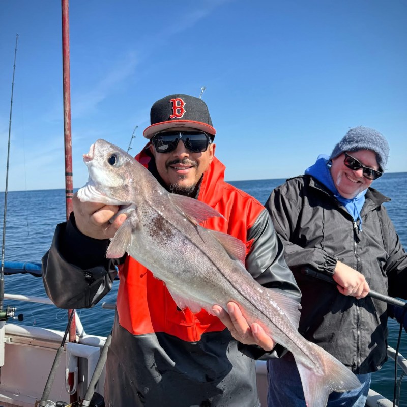 a person holding a fish