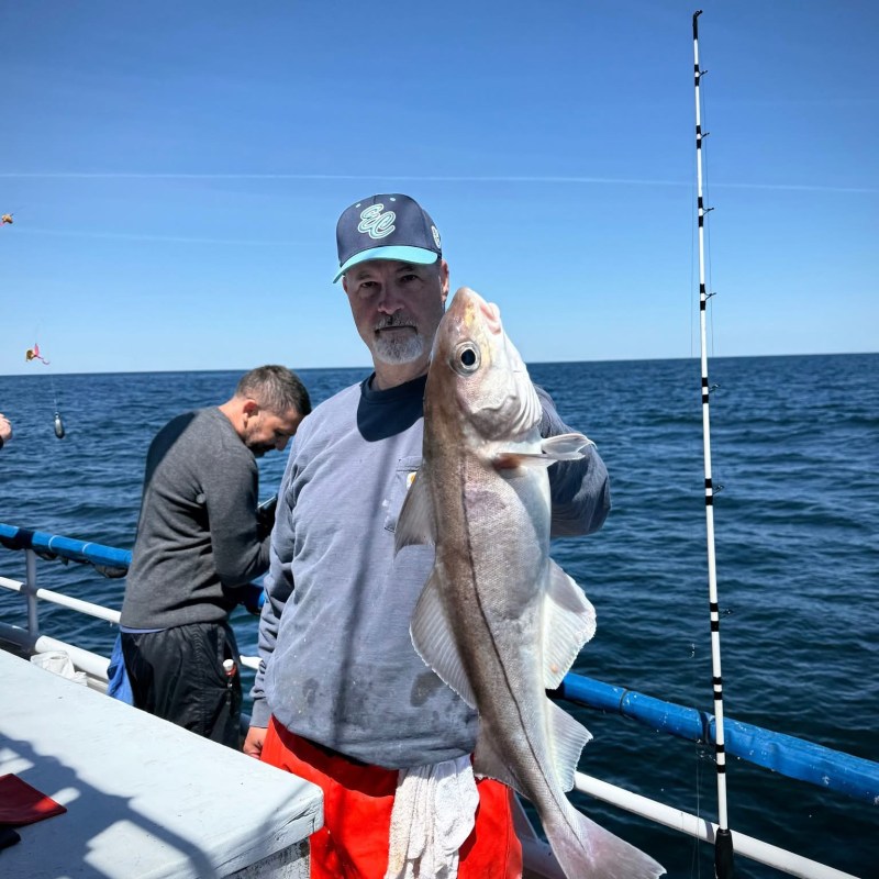 a person standing on a boat in the water