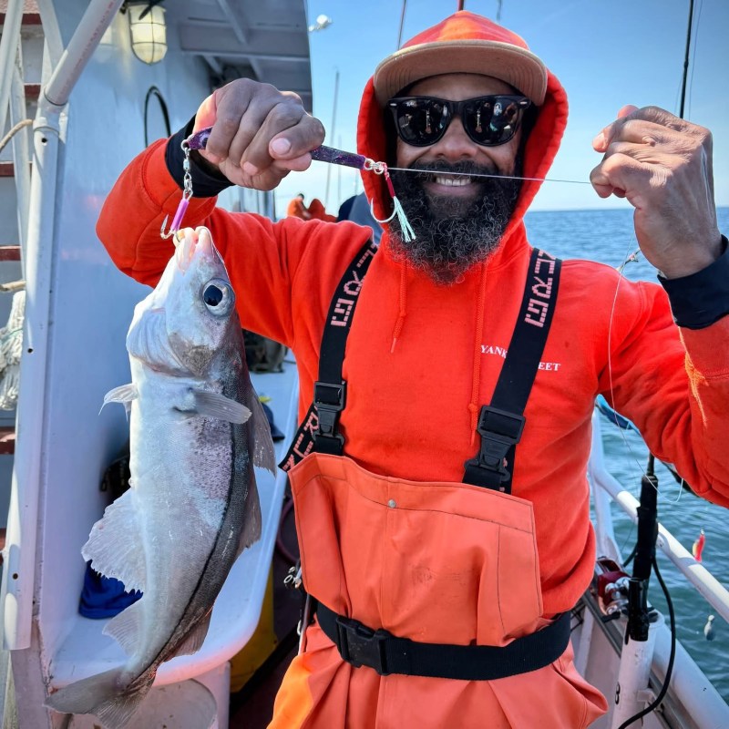 a man holding a fish