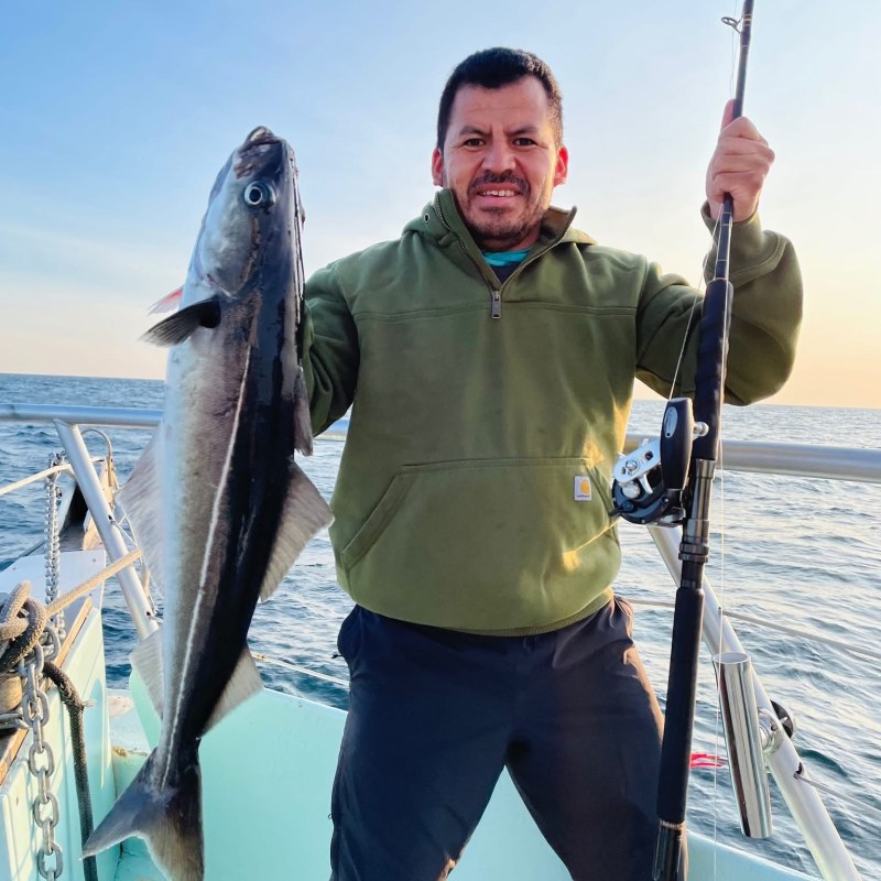 a person holding a fish