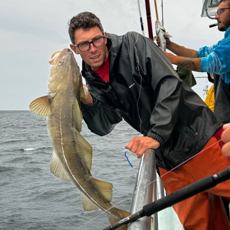 a man holding a fish