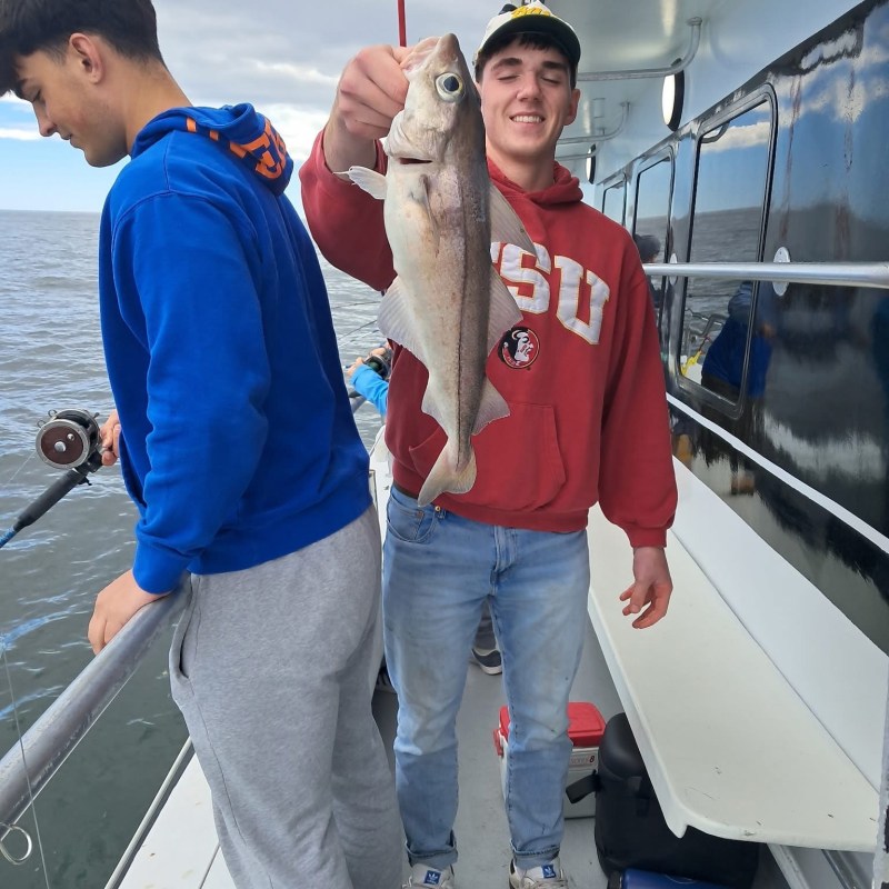 a man and a woman standing on a bridge