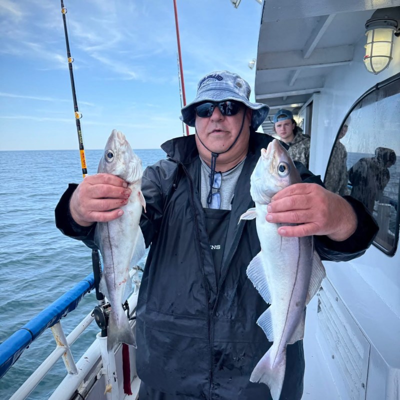 a person holding a fish