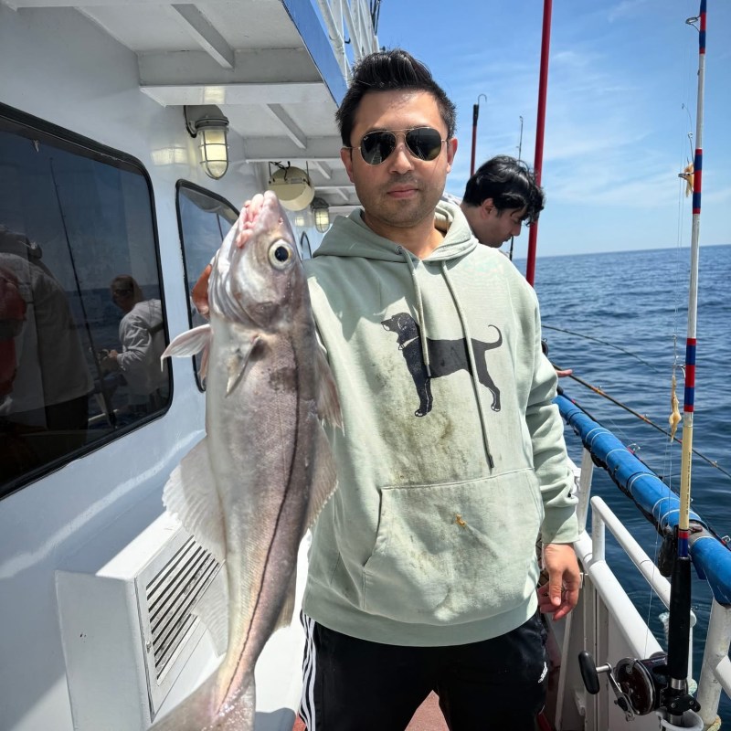 a person holding a fish