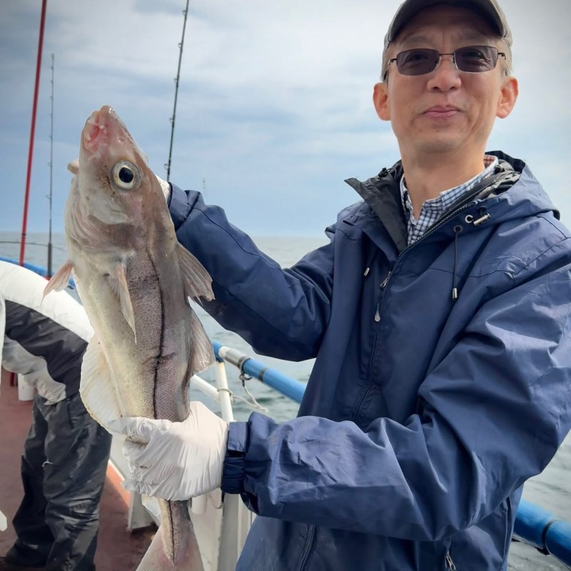 a person holding a fish