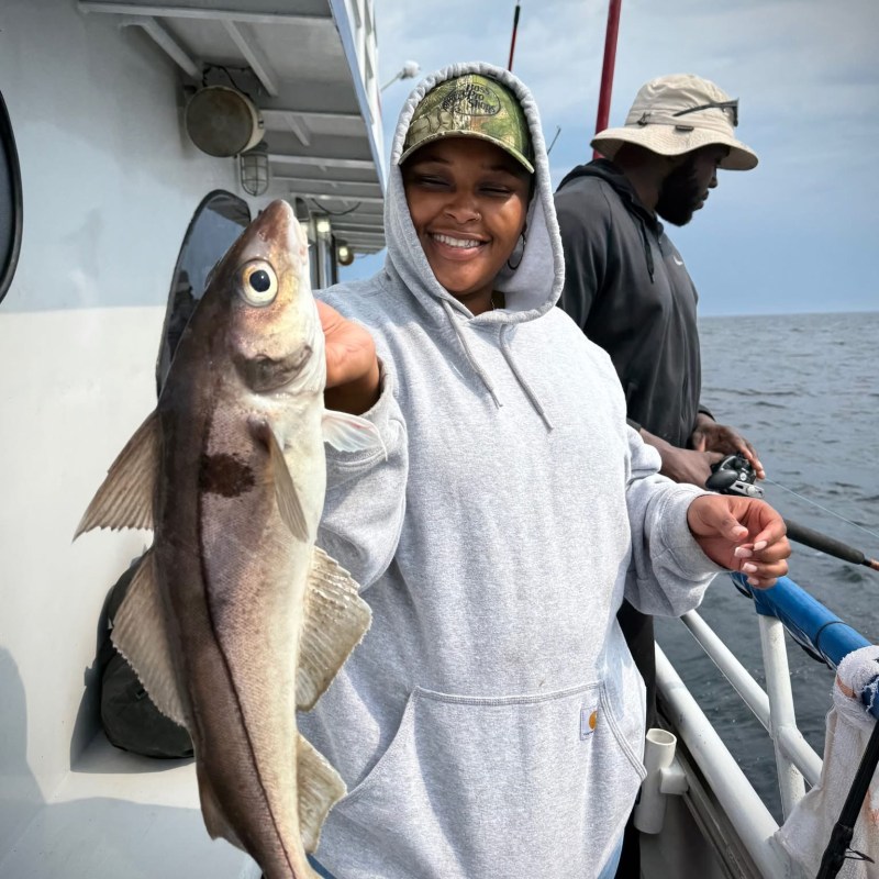a person holding a fish