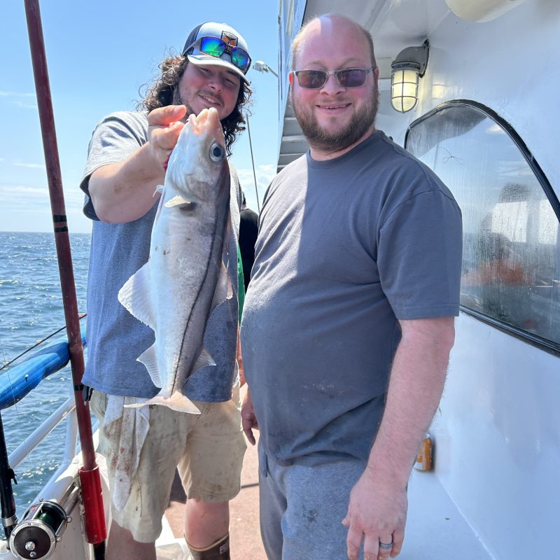 a man holding a fish