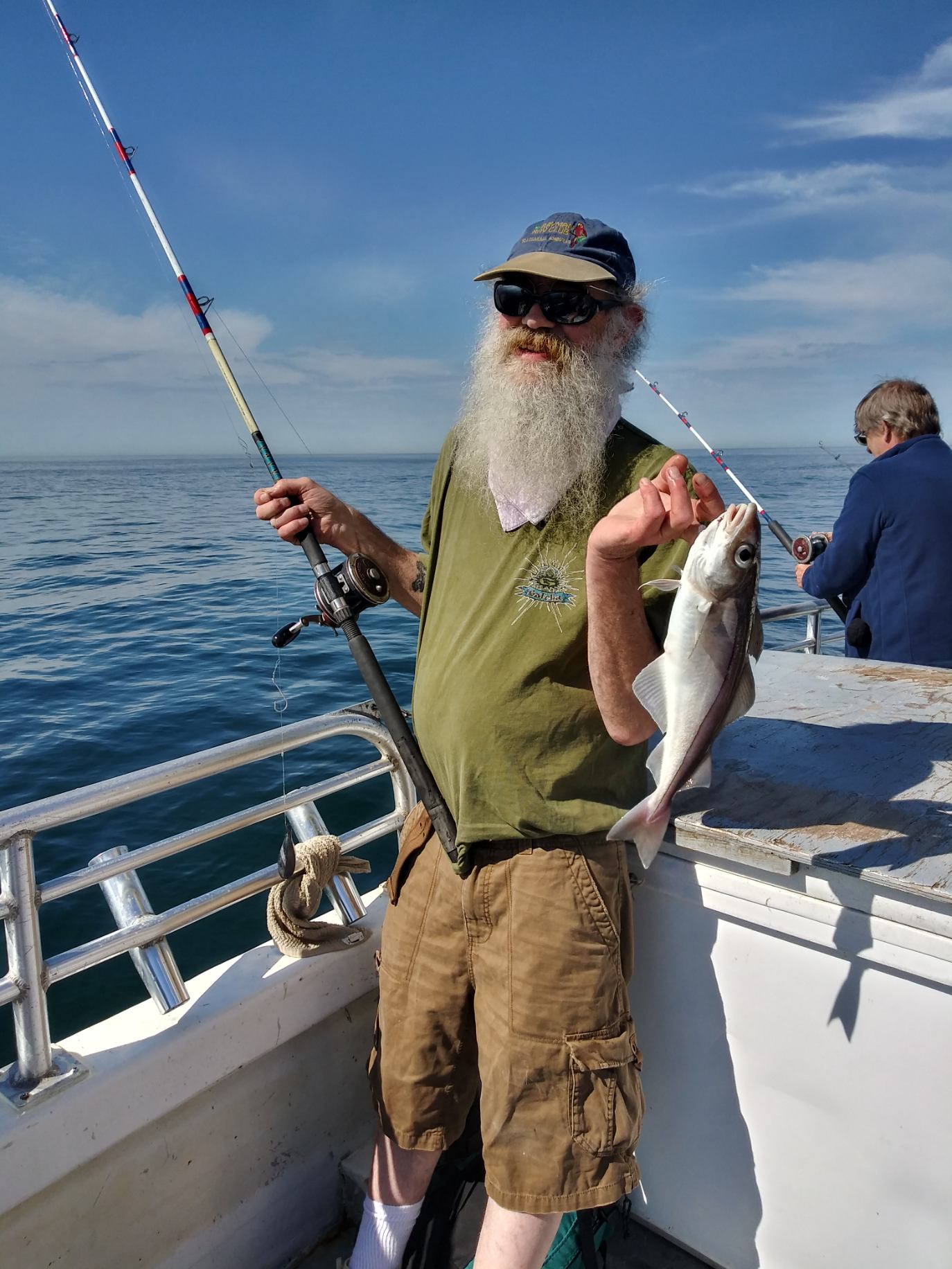 a person holding a fish in the water