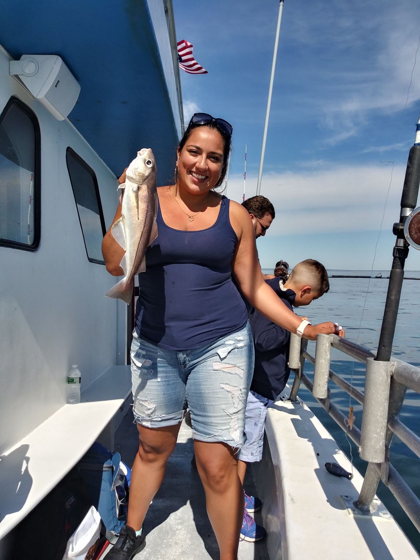 a person standing next to a boat