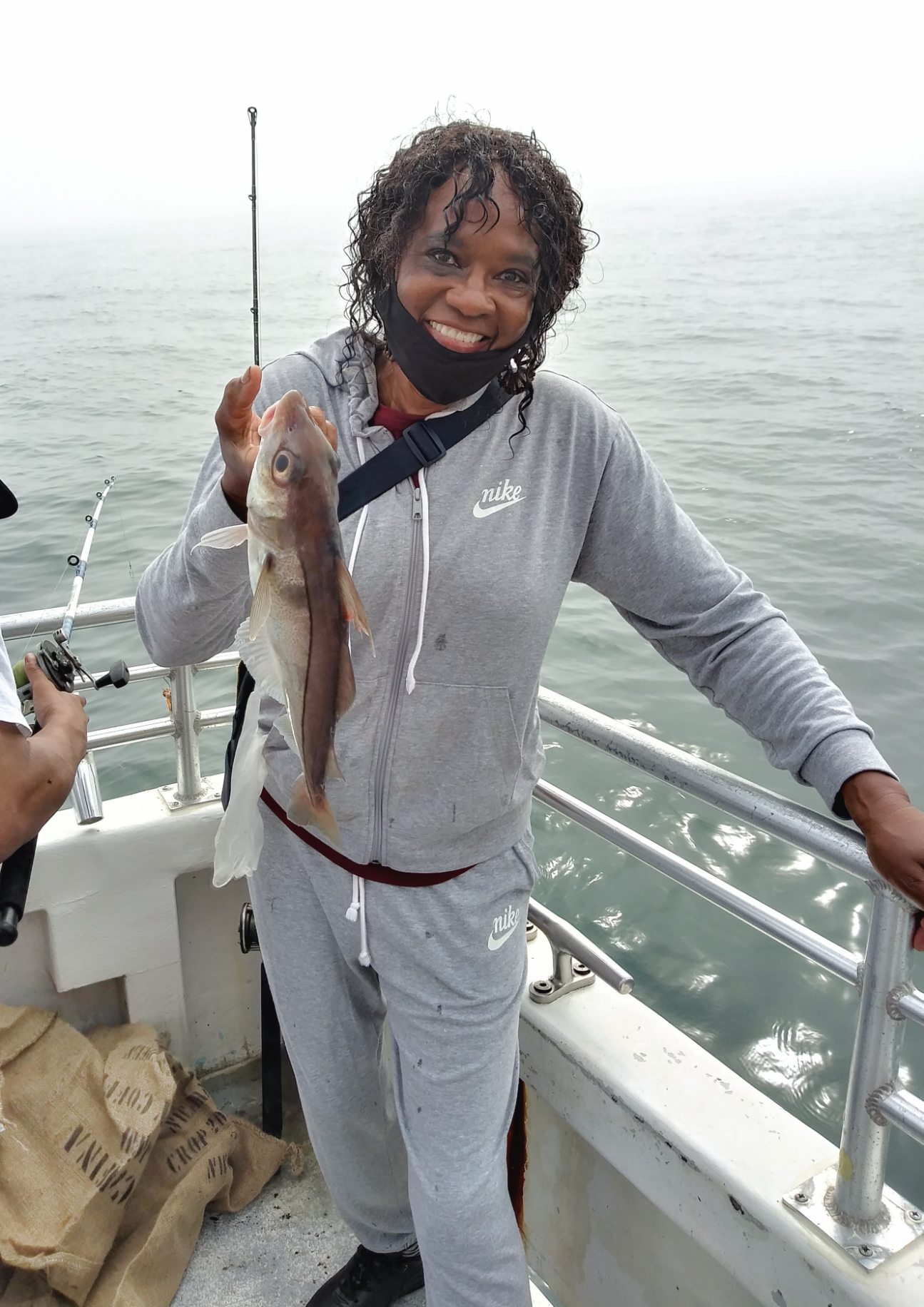 a person holding a fish in the water