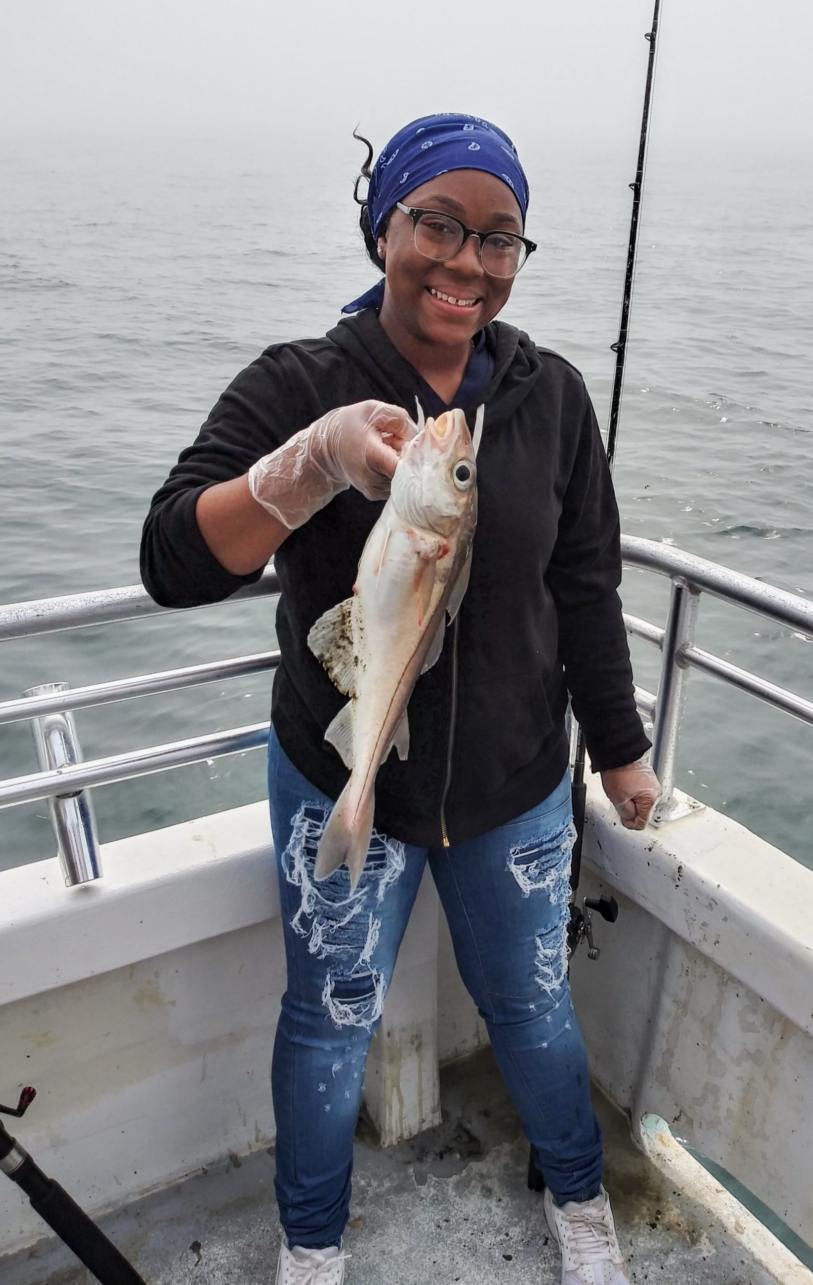 a person holding a fish in the water