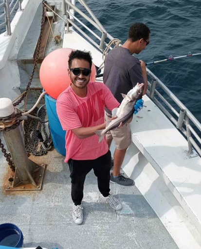 a person standing next to a dock
