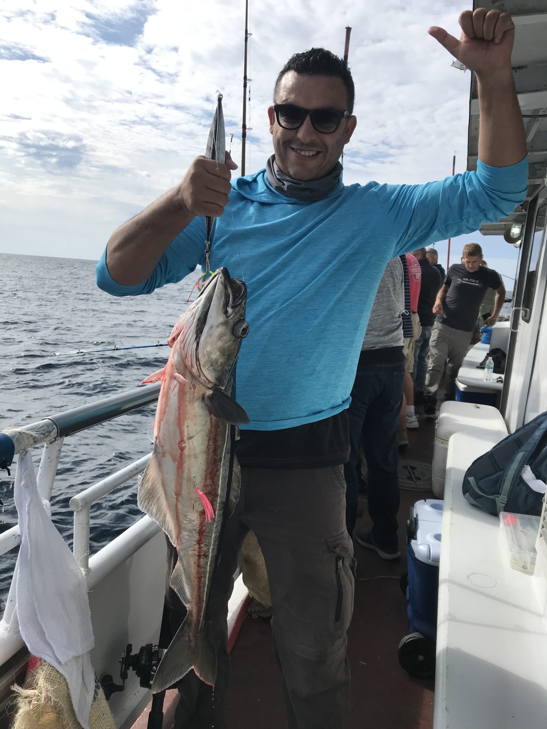 a person holding a fish in the water