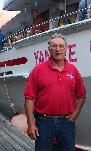 a man standing in front of a building