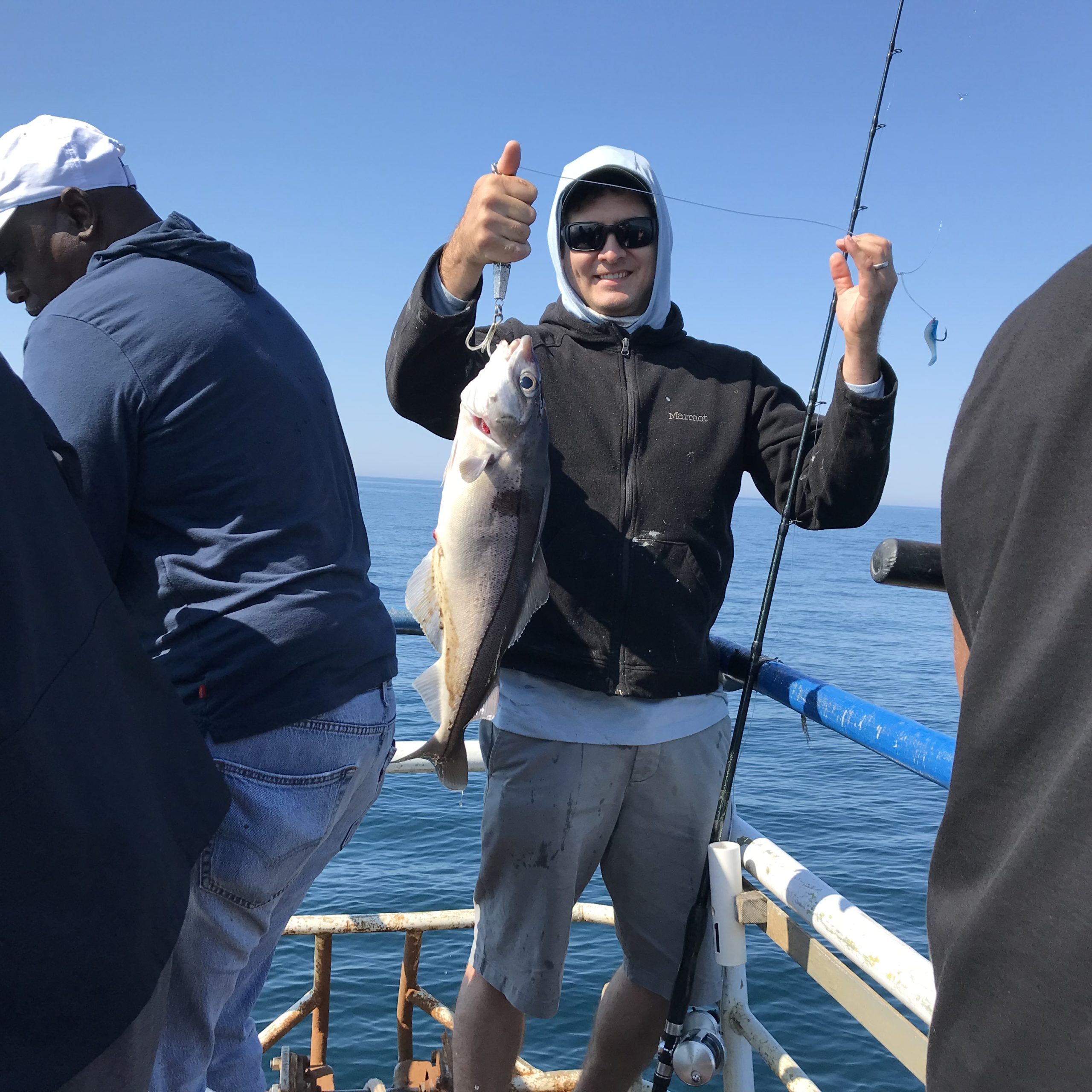 a couple of people that are standing in the water