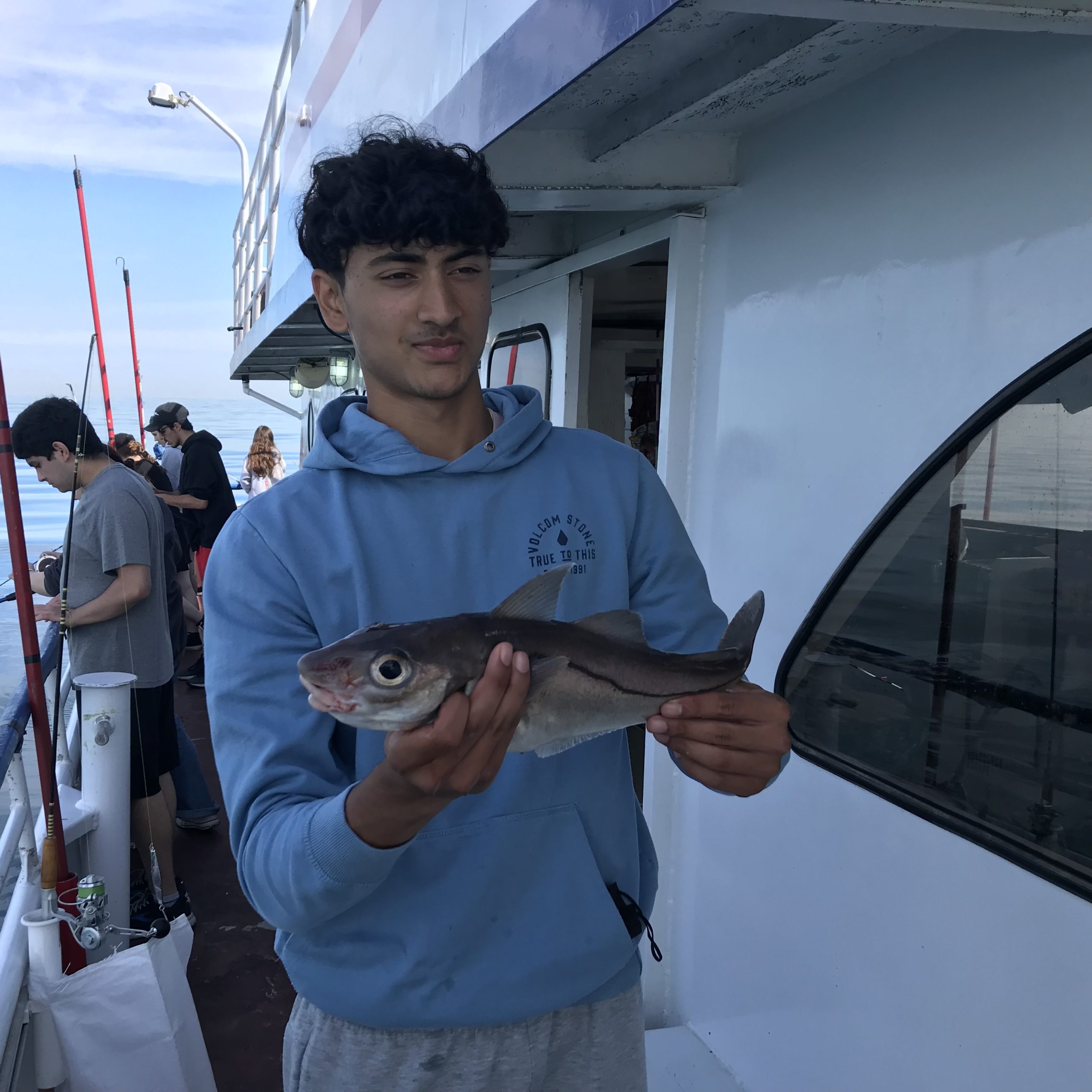 a man holding a fish